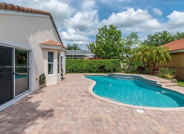 pool with a patio area