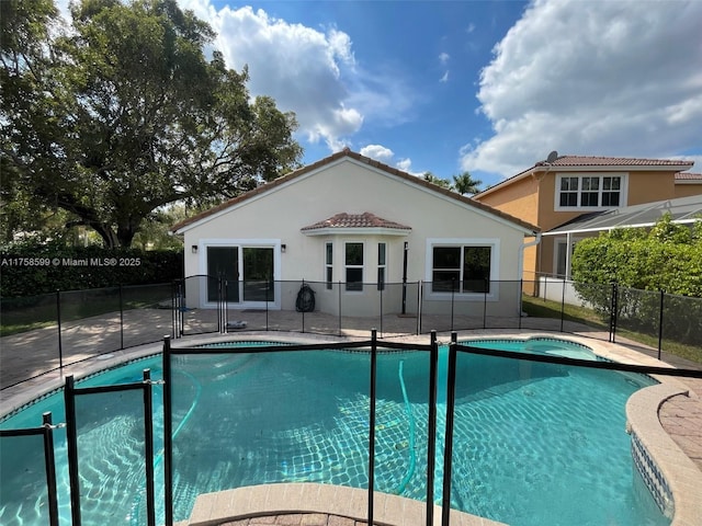 view of pool with fence, a fenced in pool, and a patio