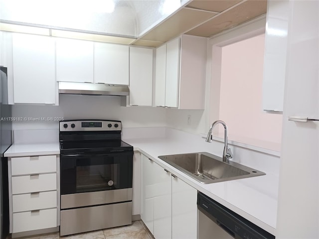 kitchen with stainless steel appliances, white cabinetry, a sink, and under cabinet range hood