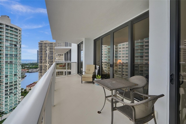 balcony with a city view and a water view