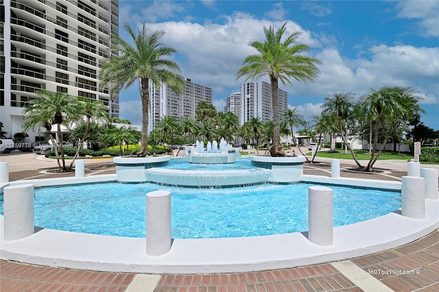 view of swimming pool with a view of city