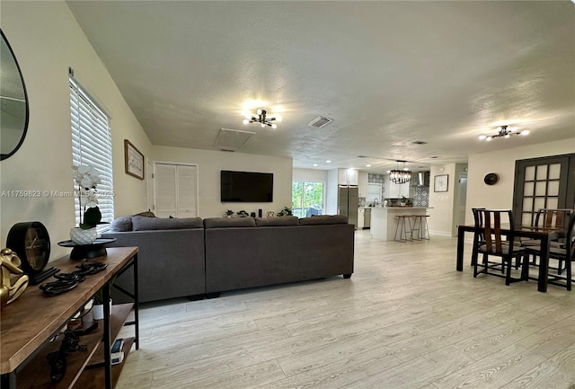 5127 Glasgow Ave, Orlando, FL 32819 - living area featuring light wood-style flooring and visible vents