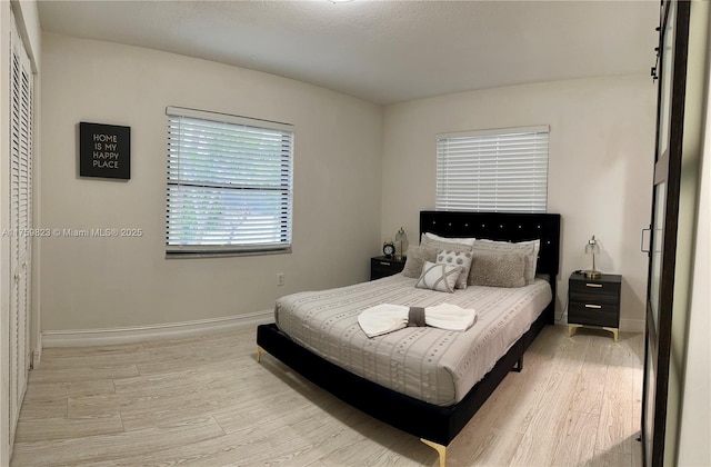 5127 Glasgow Ave, Orlando, FL 32819 - bedroom featuring baseboards and light wood-style floors