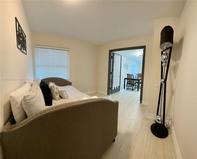 5127 Glasgow Ave, Orlando, FL 32819 - bedroom with light wood-style floors and baseboards