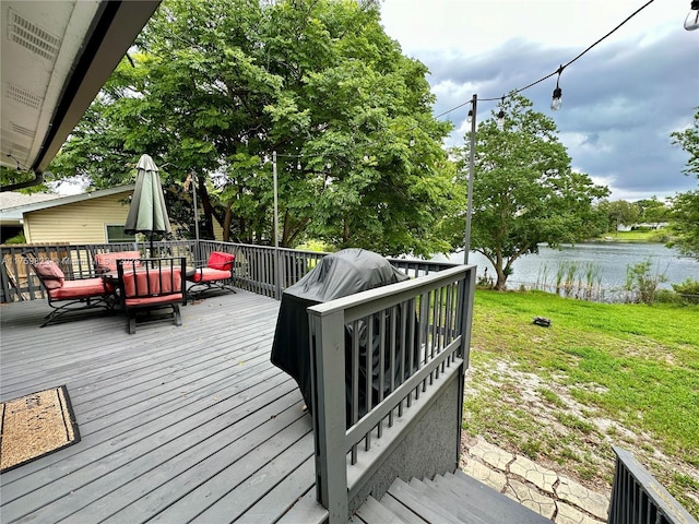 5127 Glasgow Ave, Orlando, FL 32819 - wooden deck featuring a yard, a water view, and outdoor dining space