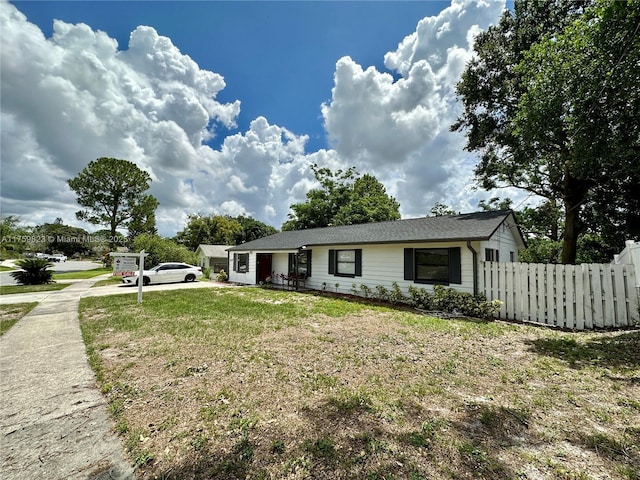 5127 Glasgow Ave, Orlando, FL 32819 - view of front facade featuring a front lawn and fence