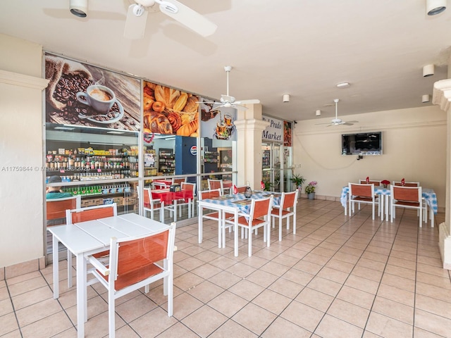 tiled dining area with ceiling fan