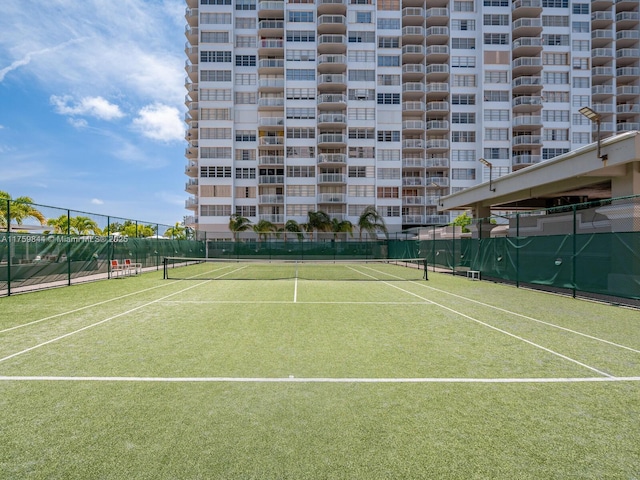 view of sport court featuring fence