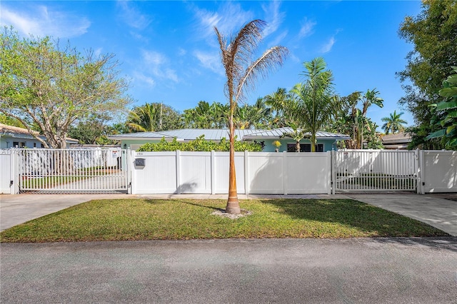 view of yard featuring a gate and a fenced front yard