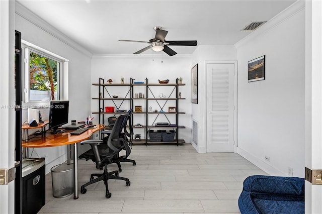 office featuring visible vents, wood finished floors, baseboards, and ornamental molding