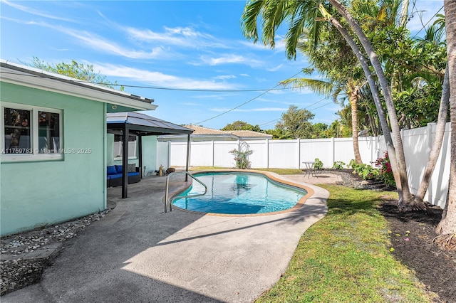 view of swimming pool with a gazebo, a patio, a fenced backyard, and a fenced in pool