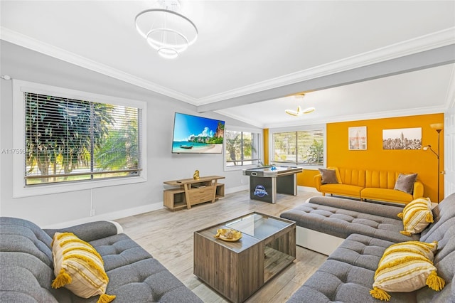 living room with baseboards, light wood-type flooring, and ornamental molding