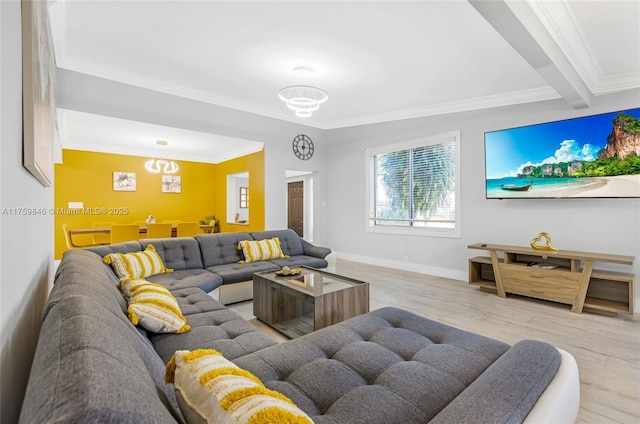 living room featuring crown molding, light wood-style floors, and baseboards