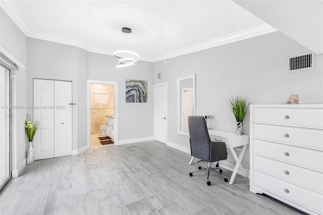 unfurnished office featuring visible vents, baseboards, and ornamental molding