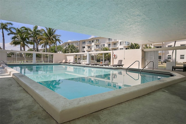 pool with a patio area