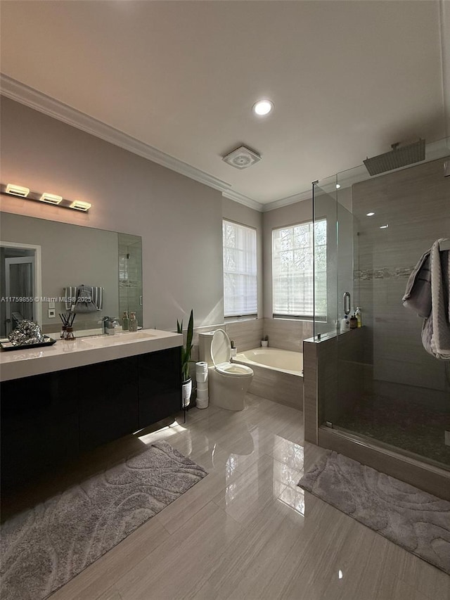 bathroom with a bath, a shower stall, crown molding, and vanity