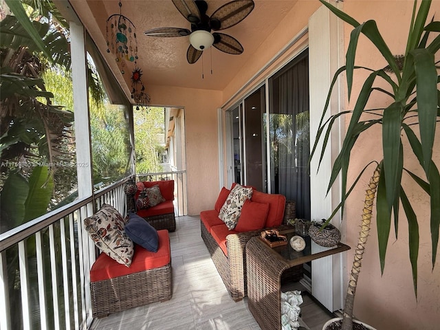 balcony with an outdoor hangout area and a ceiling fan