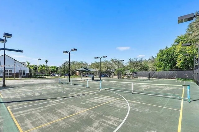 view of sport court featuring community basketball court and fence