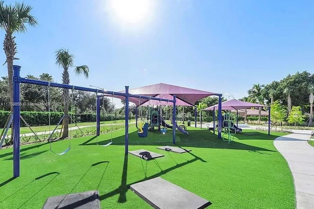 communal playground with a lawn