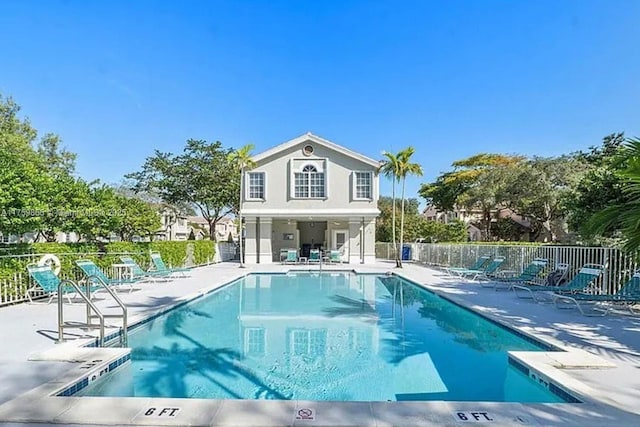 pool featuring a patio area and fence