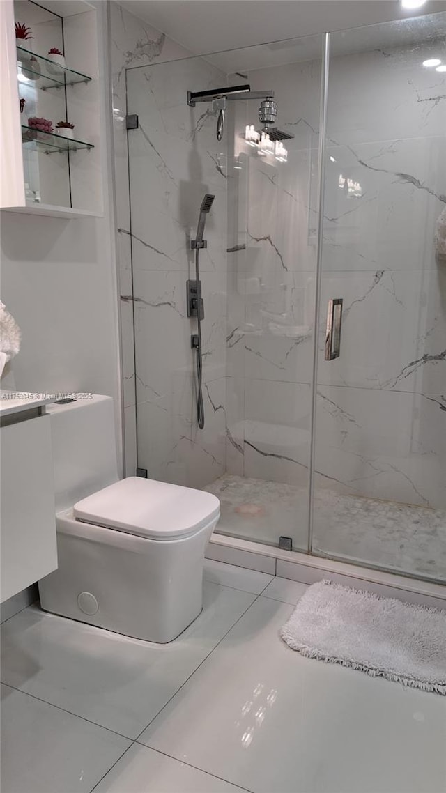 bathroom featuring a marble finish shower, marble finish floor, toilet, and vanity