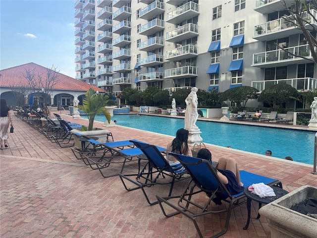 community pool featuring a patio area