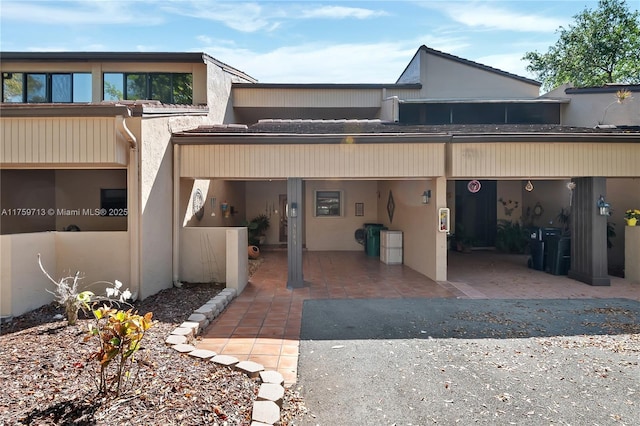 back of house with stucco siding