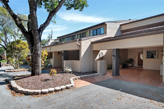 view of front of house featuring stucco siding