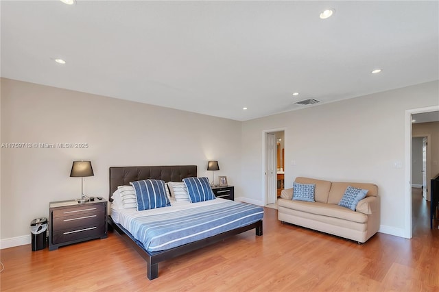 bedroom with light wood finished floors, baseboards, visible vents, and recessed lighting