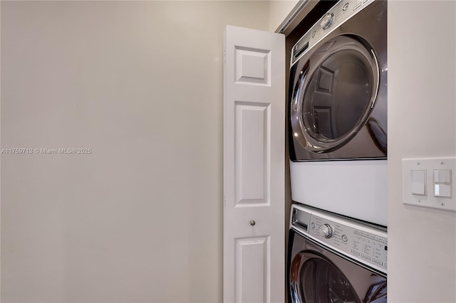 laundry area featuring laundry area and stacked washing maching and dryer