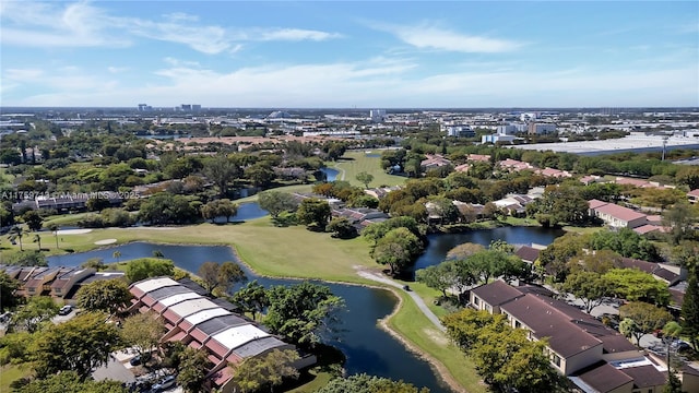 drone / aerial view featuring view of golf course and a water view