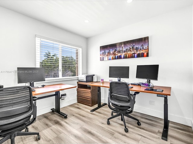 office featuring recessed lighting, wood finished floors, and baseboards