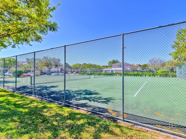 view of sport court with fence