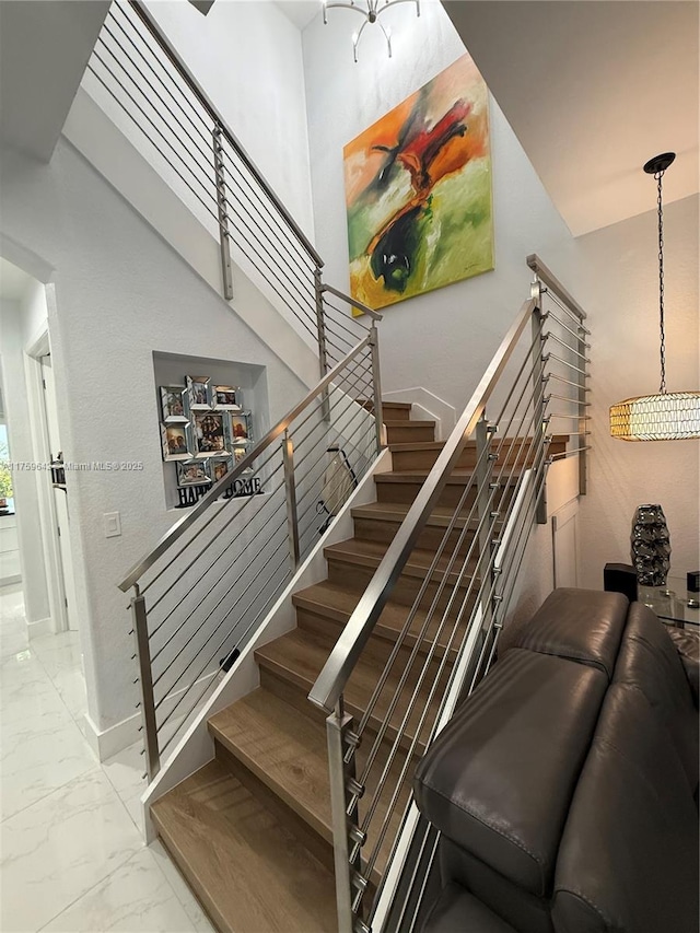 stairway with marble finish floor