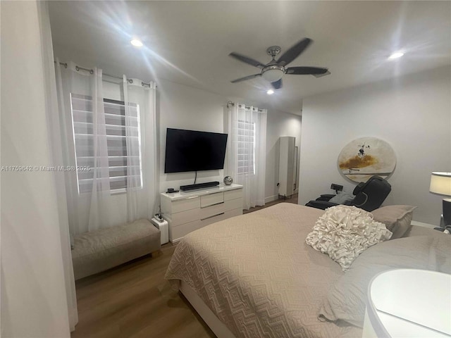 bedroom featuring a ceiling fan, recessed lighting, and wood finished floors