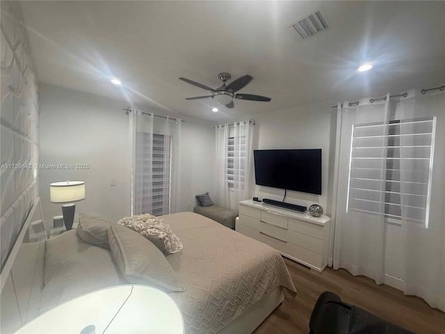 bedroom featuring visible vents, recessed lighting, ceiling fan, and wood finished floors