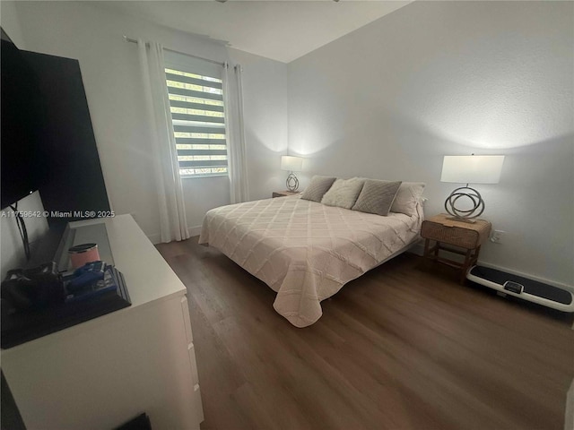 bedroom featuring wood finished floors