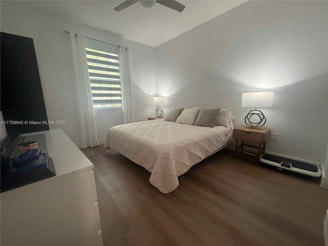 bedroom with a ceiling fan and wood finished floors