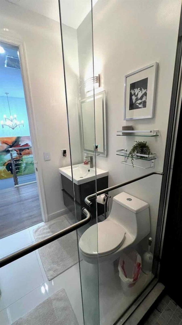 bathroom with tile patterned floors and vanity