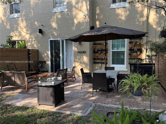 view of patio / terrace with an outdoor fire pit