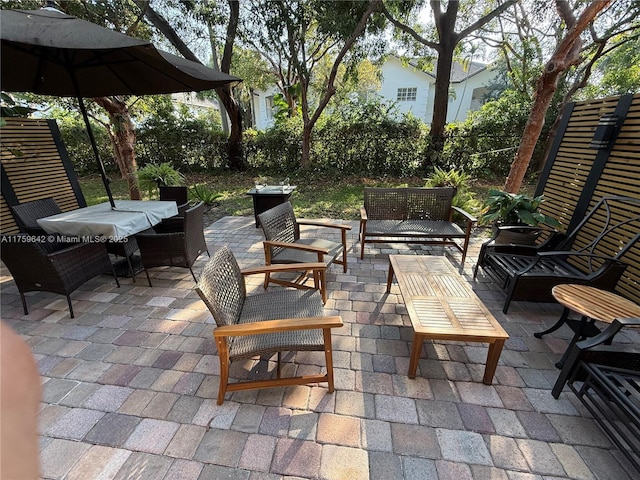 view of patio featuring outdoor lounge area and a fenced backyard