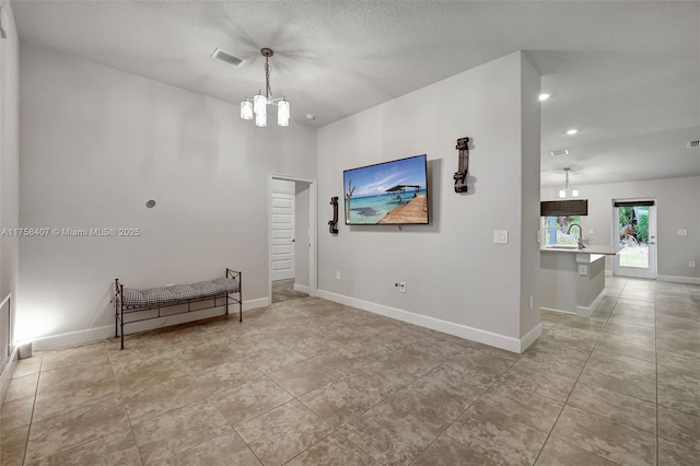 5338 Lugo St, Fort Pierce, FL 34951 - unfurnished room featuring baseboards, visible vents, light tile patterned flooring, a sink, and a chandelier