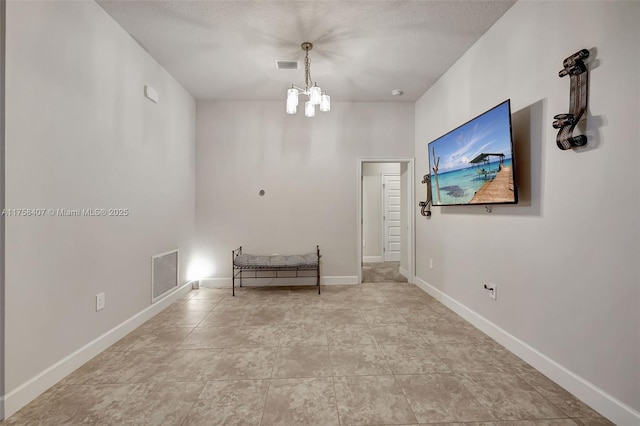 5338 Lugo St, Fort Pierce, FL 34951 - tiled spare room with a notable chandelier, baseboards, and visible vents