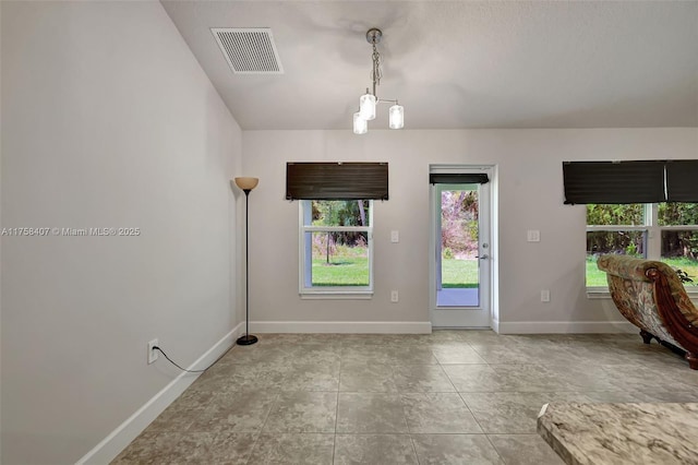 5338 Lugo St, Fort Pierce, FL 34951 - doorway to outside featuring tile patterned flooring, visible vents, and baseboards