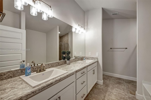5338 Lugo St, Fort Pierce, FL 34951 - bathroom with double vanity, visible vents, a stall shower, and a sink
