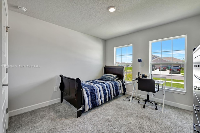 5338 Lugo St, Fort Pierce, FL 34951 - carpeted bedroom with baseboards and a textured ceiling