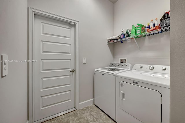 5338 Lugo St, Fort Pierce, FL 34951 - washroom featuring laundry area, light tile patterned floors, washing machine and dryer, and baseboards
