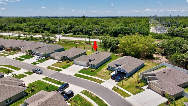 5338 Lugo St, Fort Pierce, FL 34951 - birds eye view of property with a residential view and a wooded view
