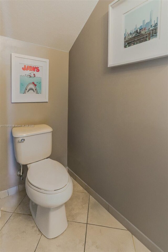 2853 SE 1st Dr Unit 4, Homestead, FL 33033 - bathroom featuring baseboards, toilet, and tile patterned flooring