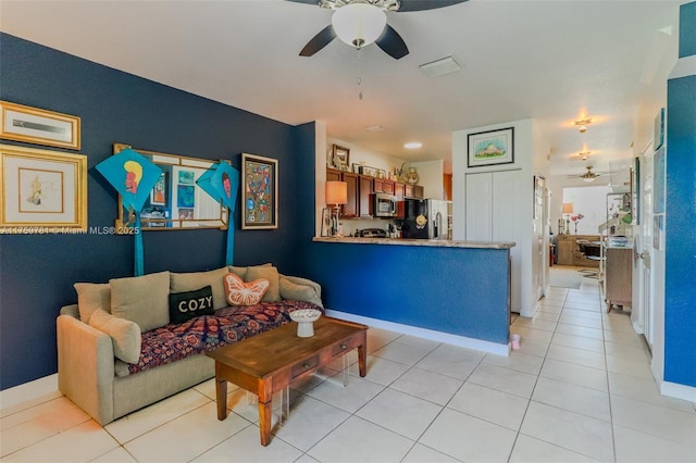 2853 SE 1st Dr Unit 4, Homestead, FL 33033 - living area featuring light tile patterned floors, a ceiling fan, and baseboards